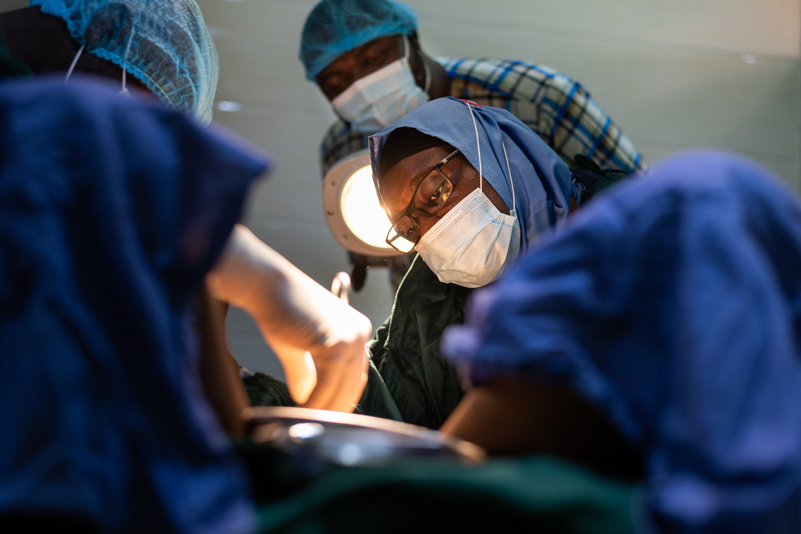 A doctor and her team treat a patient