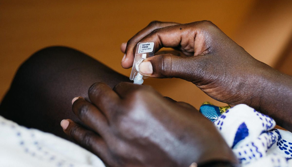 A woman in Senegal self-injects the contraceptive, subcutaneous DMPA in her leg.
